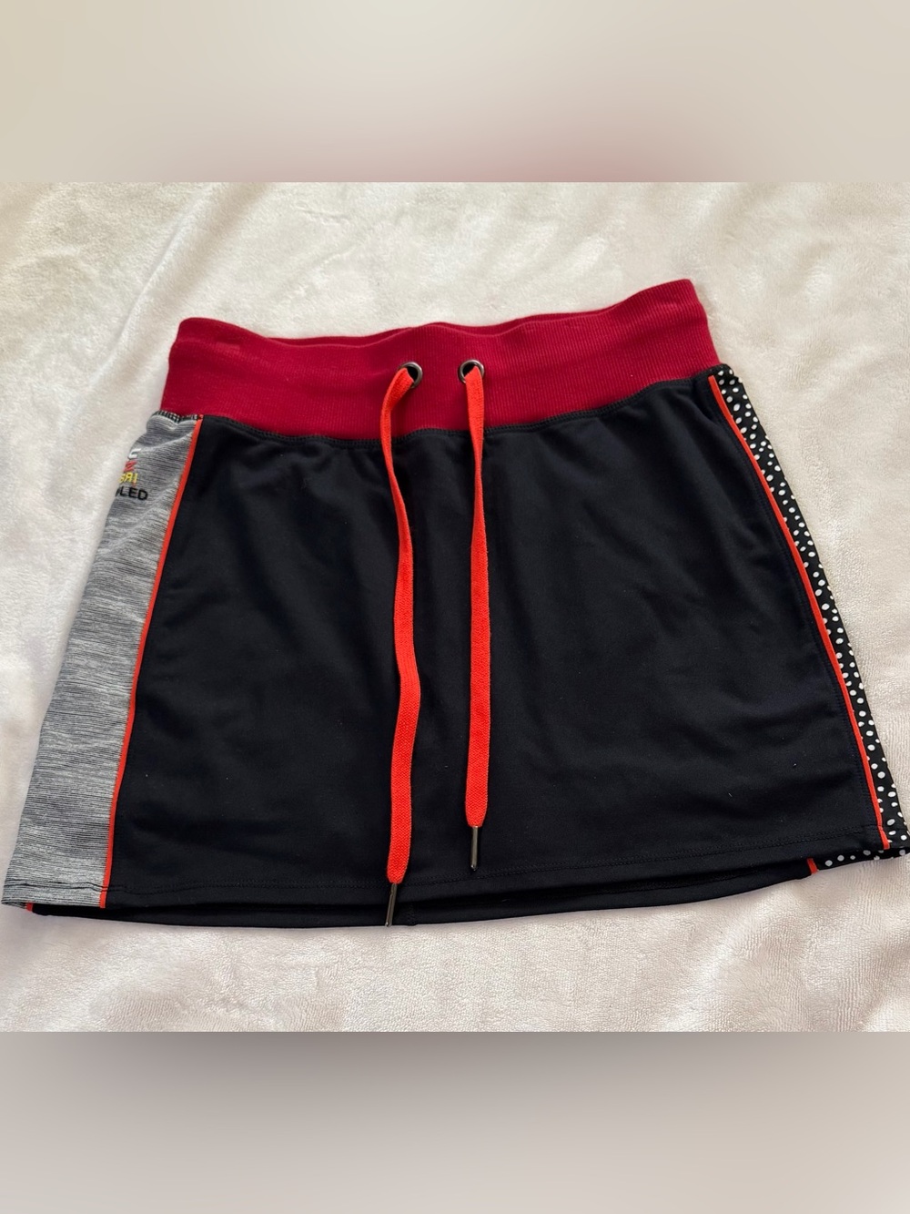 Unbridled Black and Red mini Skort with Yellow Letters and Red Drawstring